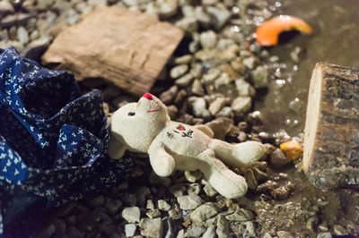 High angle view of abandoned teddy bear at junkyard