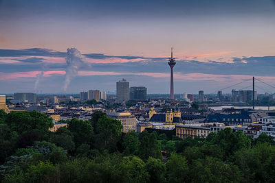 Aerial view of city buildings during sunset