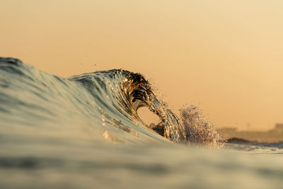 Scenic view of desert against sky during sunset
