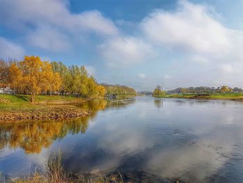 Scenic view of lake against sky during autumn
