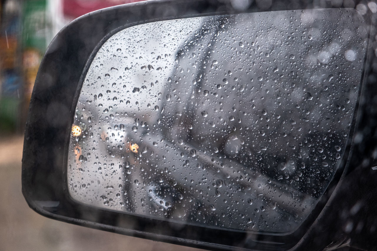 CLOSE-UP OF RAINDROPS ON WINDOW