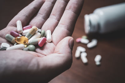 Close-up of hand holding medicines