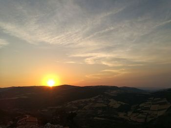 Scenic view of landscape against sky during sunset