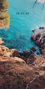 High angle view of rocks at sea shore