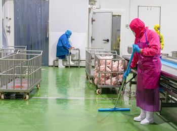 Rear view of man working in market