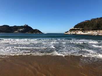 View of sea against clear blue sky