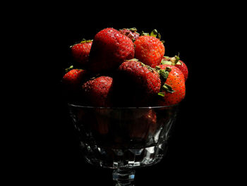 Close-up of fruits against black background