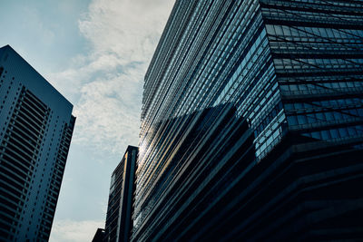 Low angle view of modern buildings against sky in city