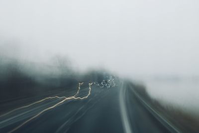 Car on road against sky during winter