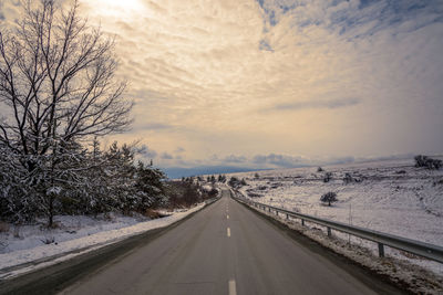 Winter road. country road through forest. travel concept.