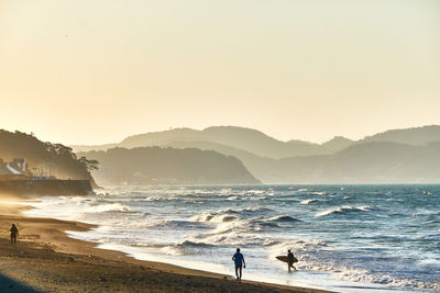 Scenic view of sea against sky during sunrise