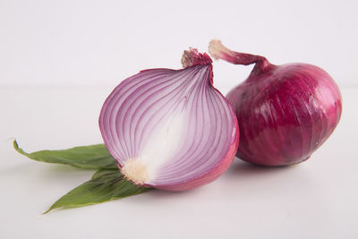 Close-up of garlic on white background