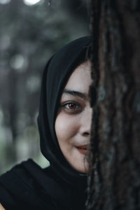 Portrait of young woman wearing hijab