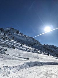 Snow covered mountain against sky