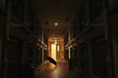 Empty illuminated corridor of building