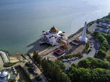 High angle view of buildings by sea