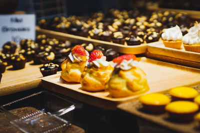 Close-up of ice cream with food on table