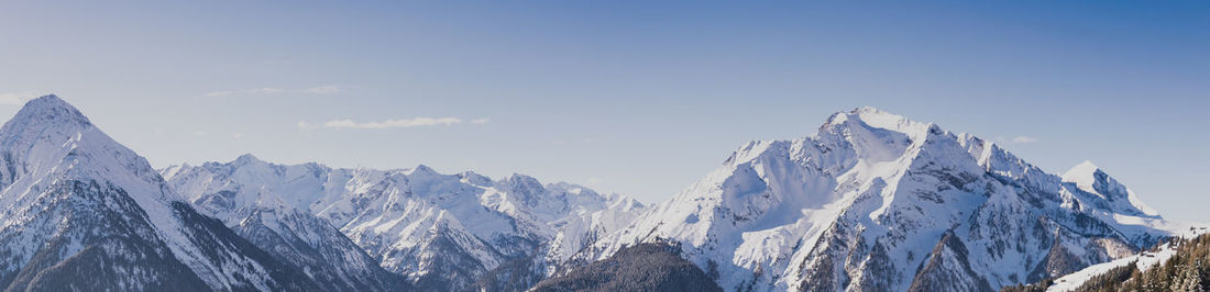 Scenic view of mountains against sky during winter