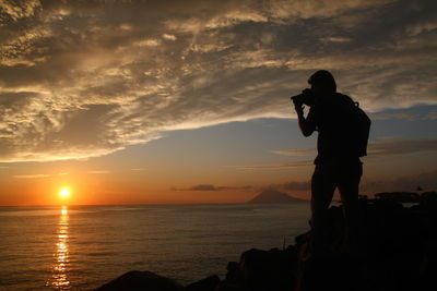 Scenic view of sea at sunset