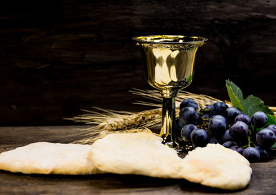 Close-up of grapes in glass on table