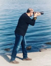 Full length of man standing in sea