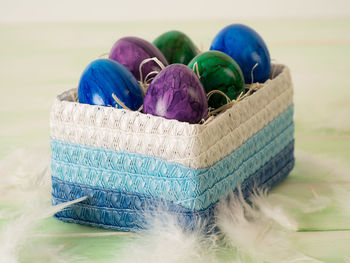 Close-up of multi colored wicker basket on table