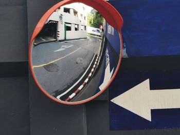 Close-up of traffic sign on road in city