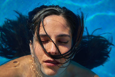 Portrait of woman swimming in pool