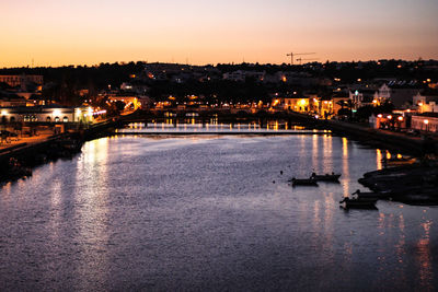 View of illuminated city at sunset