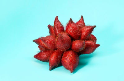 Close-up of strawberry over white background