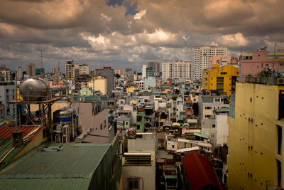 High angle view of buildings in city against sky