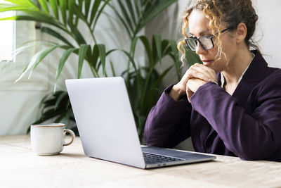 Young man using laptop on table