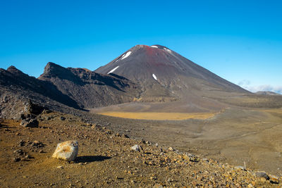 Scenic view of mount ngauruhoe in tongariro national park against blue sky