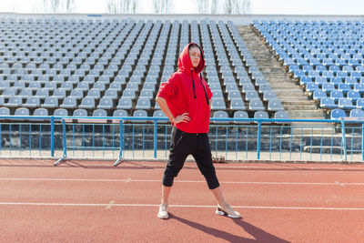 Full length of woman standing in stadium
