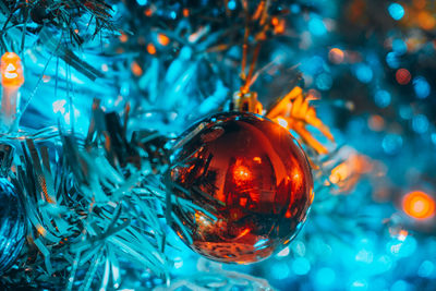 Close-up of illuminated christmas tree at night