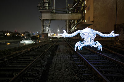 Railroad tracks at night