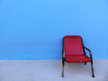 Chair against blue wall