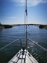 Sailboat in sea against sky