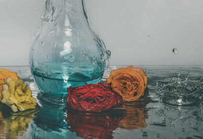 Close-up of rose bouquet on glass table