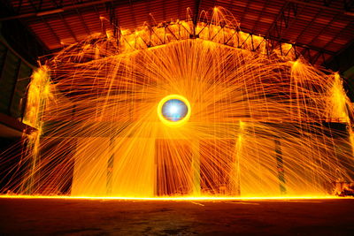 Wire wool spinning indoors at night
