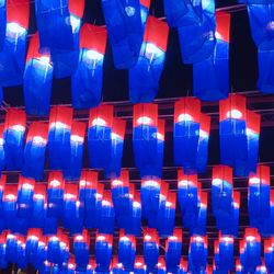 Low angle view of illuminated lights at night