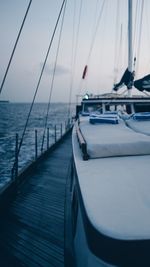 Sailboat sailing on sea against sky