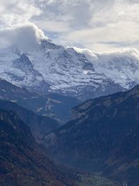 Scenic view of snowcapped mountains against sky