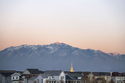 Buildings against clear sky during winter