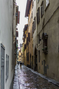 Narrow street amidst buildings in town