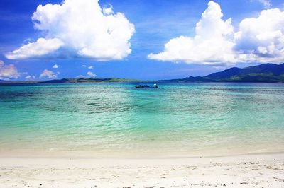 Scenic view of sea against cloudy sky