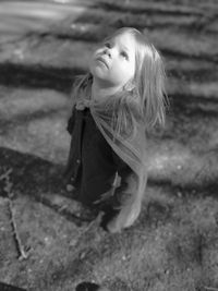 Portrait of young woman looking up