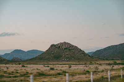 Scenic view of landscape and mountains against sky