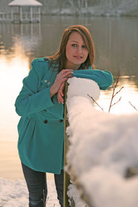 Portrait of young woman standing outdoors