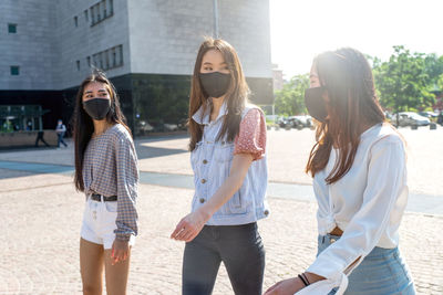 Group of people standing in city